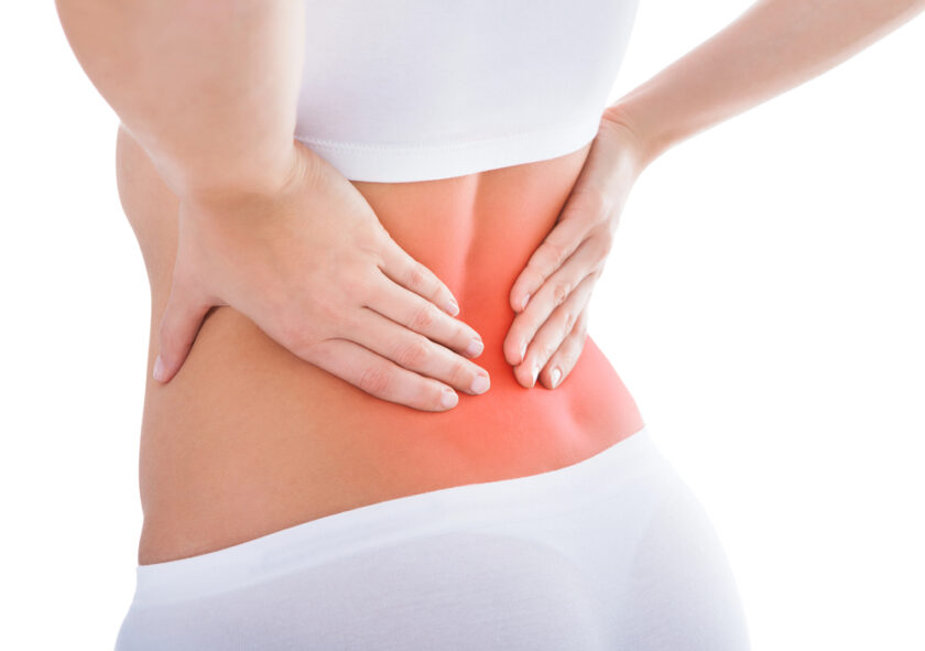 Person holding their back which is slightly red