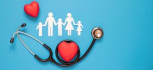 Paper cut out of family stethoscope and hearts