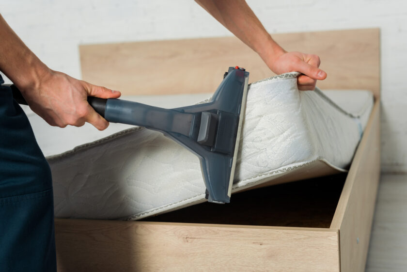 Man cleaning a mattress 