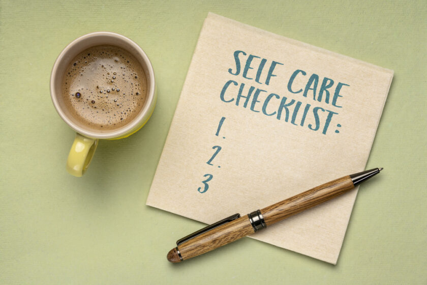 self care checklist - handwriting on a napkin with a cup of coffee, healthy lifestyle, habits and personal development concepts