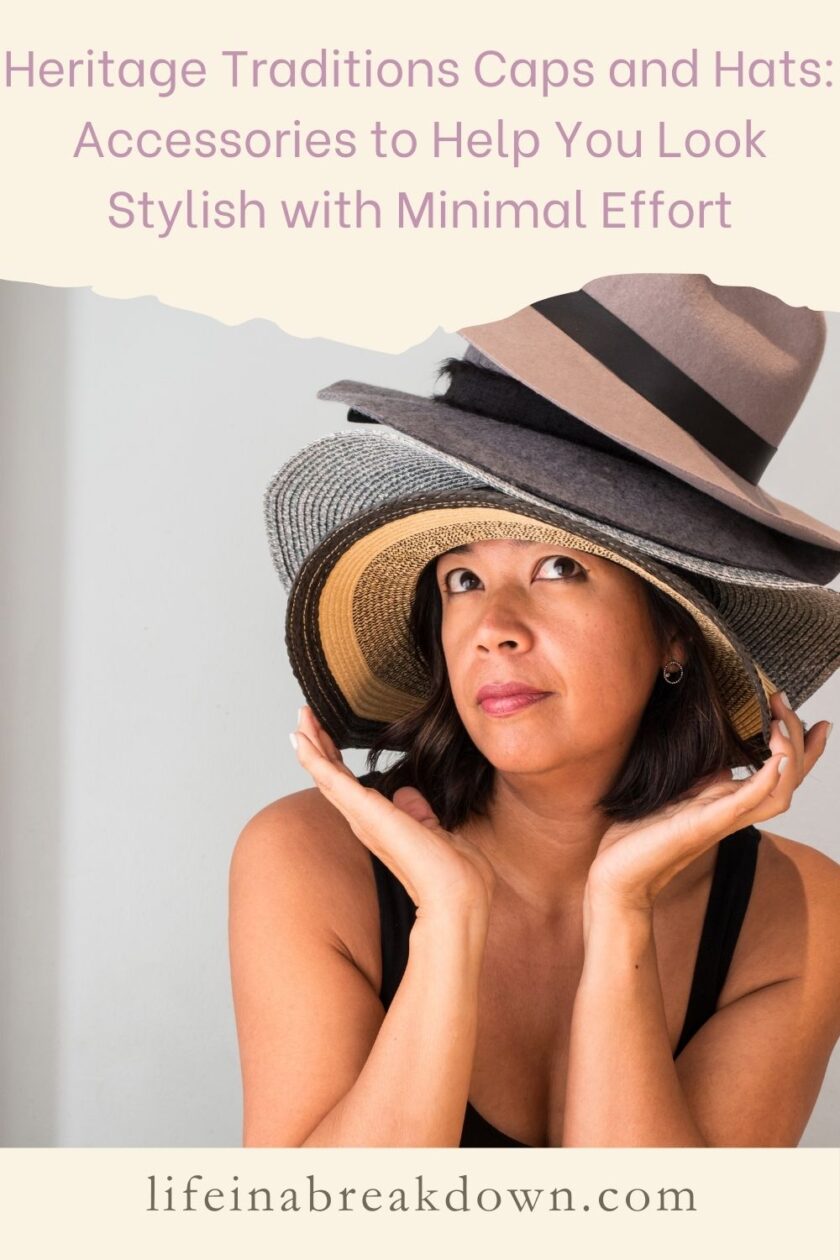 A woman wearing multiple hats stacked on her head, including a wide-brimmed straw hat and a felt hat, looking upward. The text on the image reads Heritage Traditions Caps and Hats: Accessories to Help You Look Stylish with Minimal Effort.