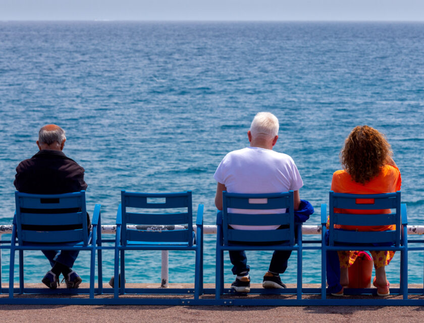 People sat by the sea 