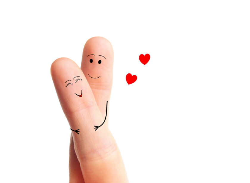 Two fingers twisted together to signify romanace