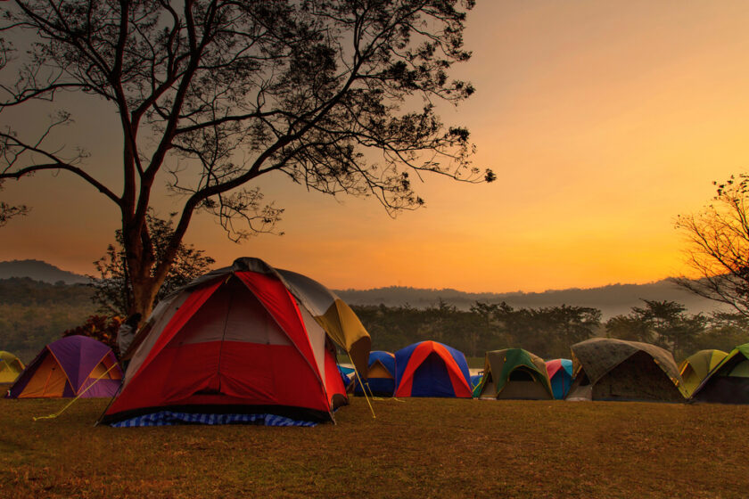 Tents with the sun setting in the background