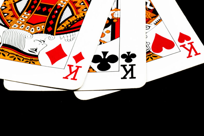 playing cards against a black