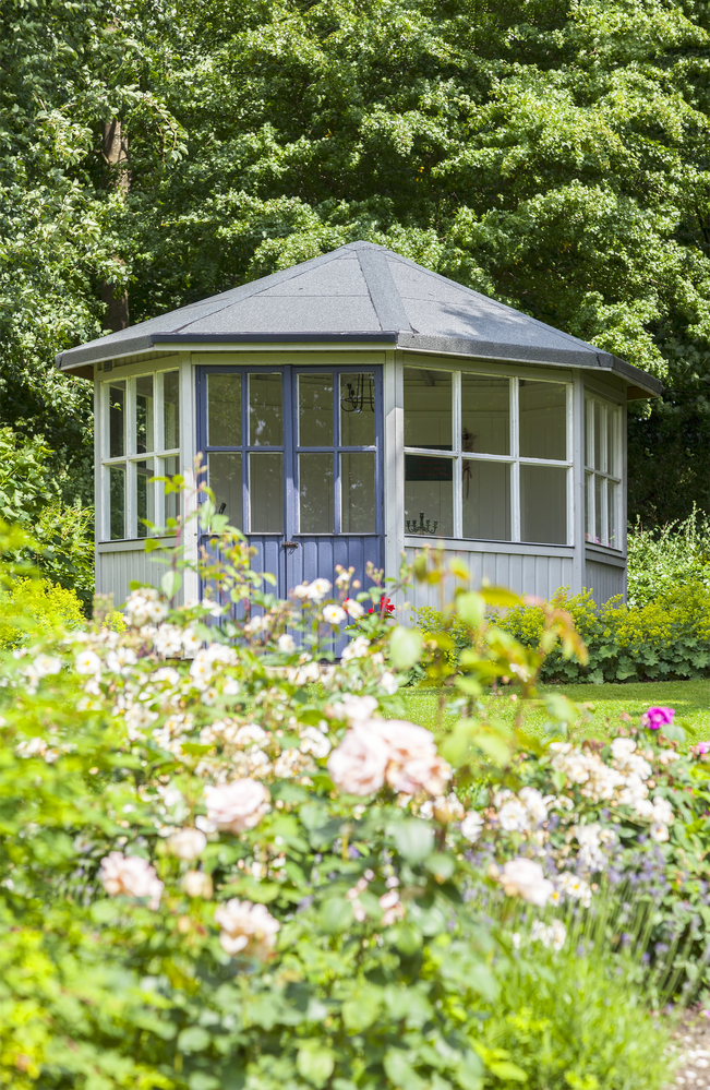 Image of lush garden with romantic gazebo.