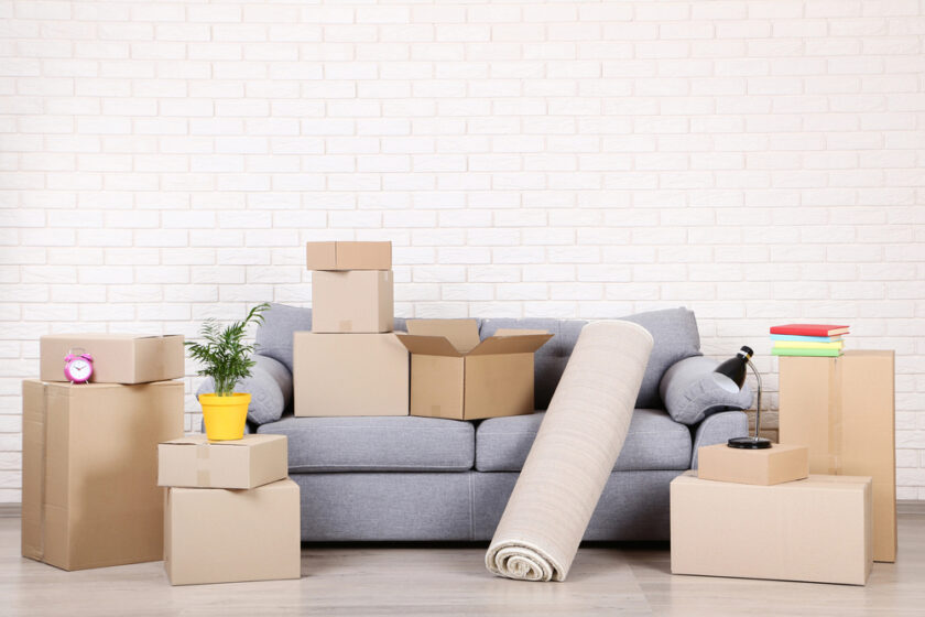 Boxes laid around and on a sofa 