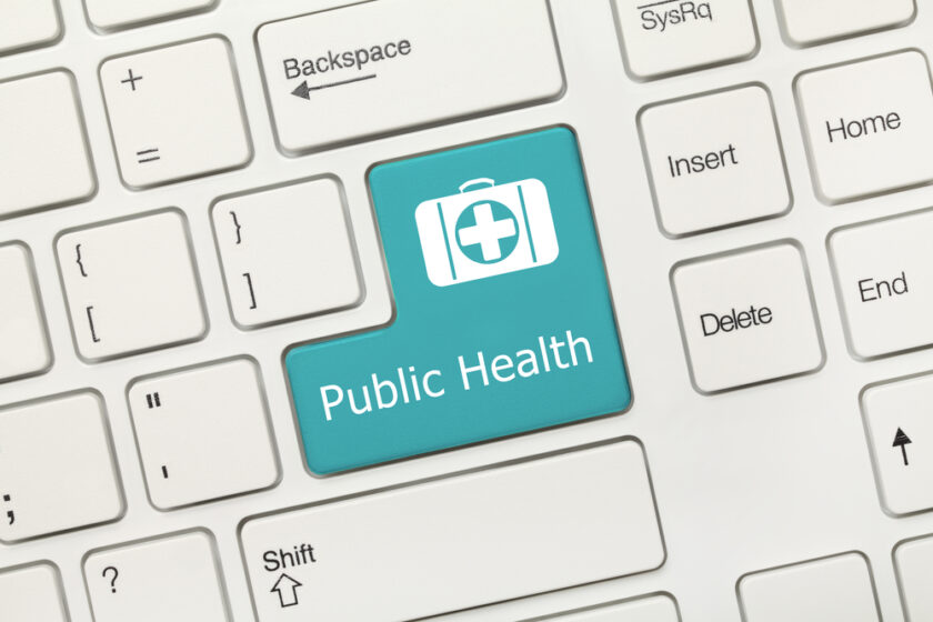 Close-up view on white conceptual keyboard - Public Health (blue key)