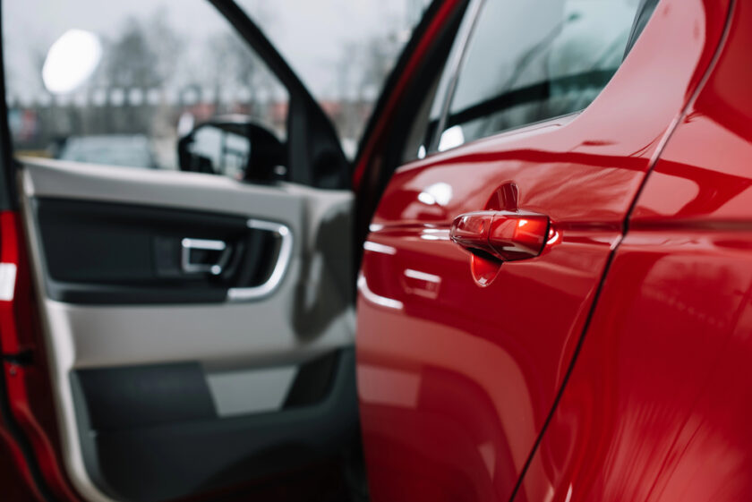 red car with door open