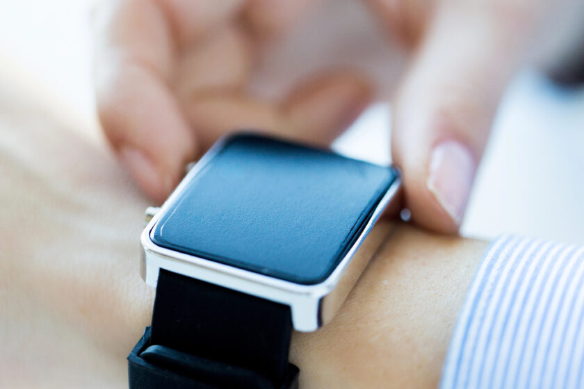 Business man checking his smart watch