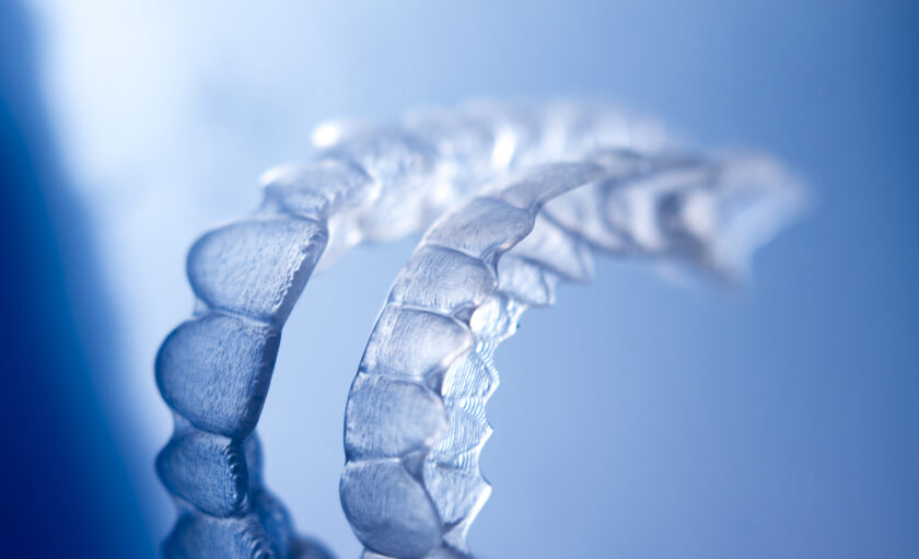 Invisible dental bracket aligners for modern orthodontic treatment to straighten teeth and improve dental hygiene.