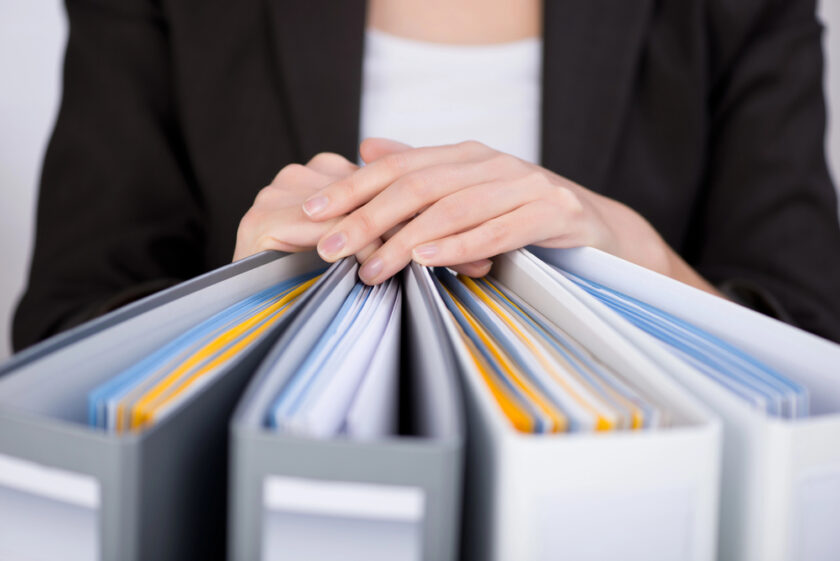 Person with hands on a file