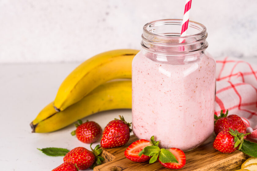 Strawberry milkshake or smoothie in mason jar. Summer dessert. Healthy diet food.