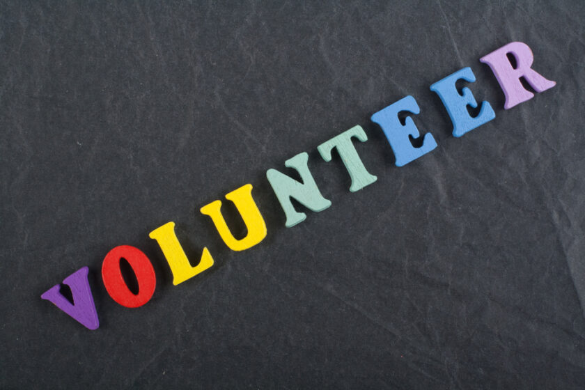 VOLUNTEER word on black board background