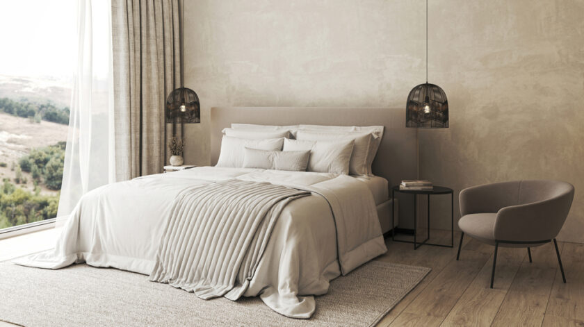 Inviting bedroom design offering a serene retreat with comfortable bedding, elegant pendant lights, and a breathtaking scenic view