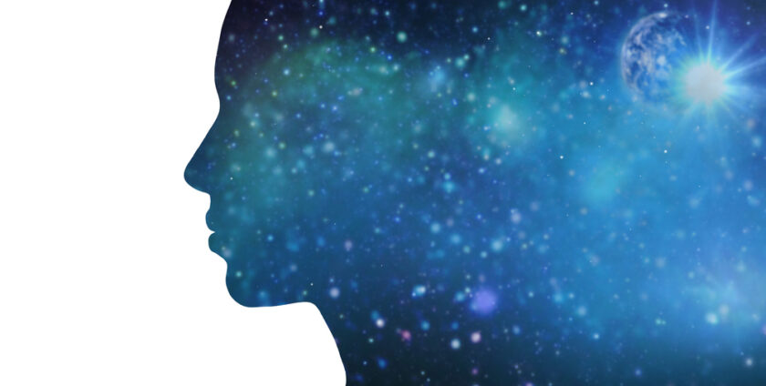 Shape of a head with a sky like backdrop