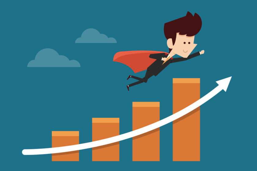 successful businessman flying on graph