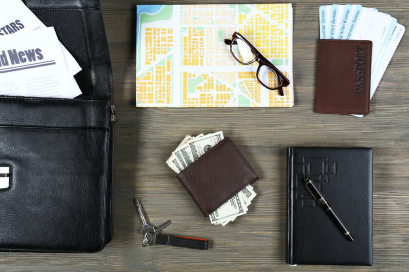 Set of trip glasses money passport etc on wooden background
