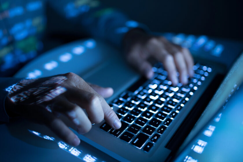 Person working on a keyboard