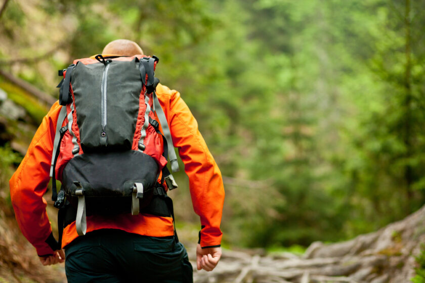 Person backpacking on a trail 