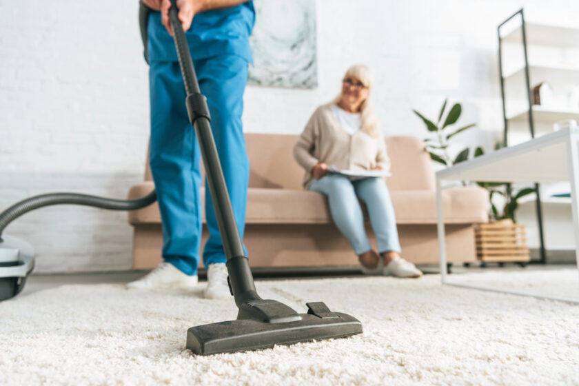 Person hoovering in a home