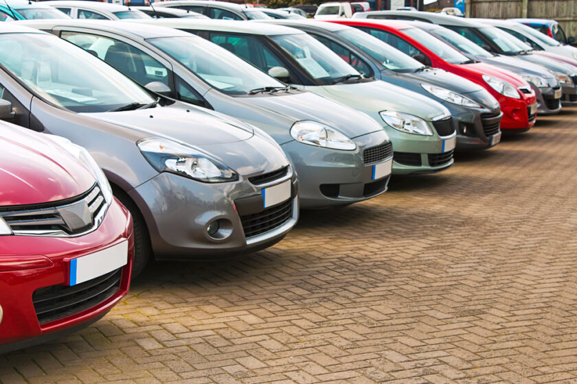 cars lined up in a car dealership