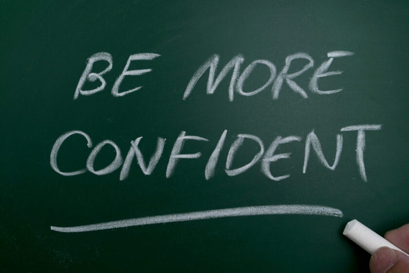 Be more confident, text written on chalkboard,