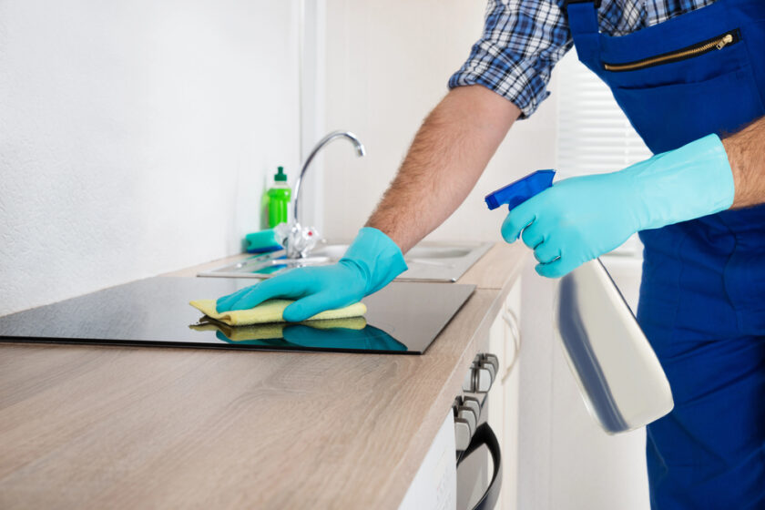 Person cleaning a worktop