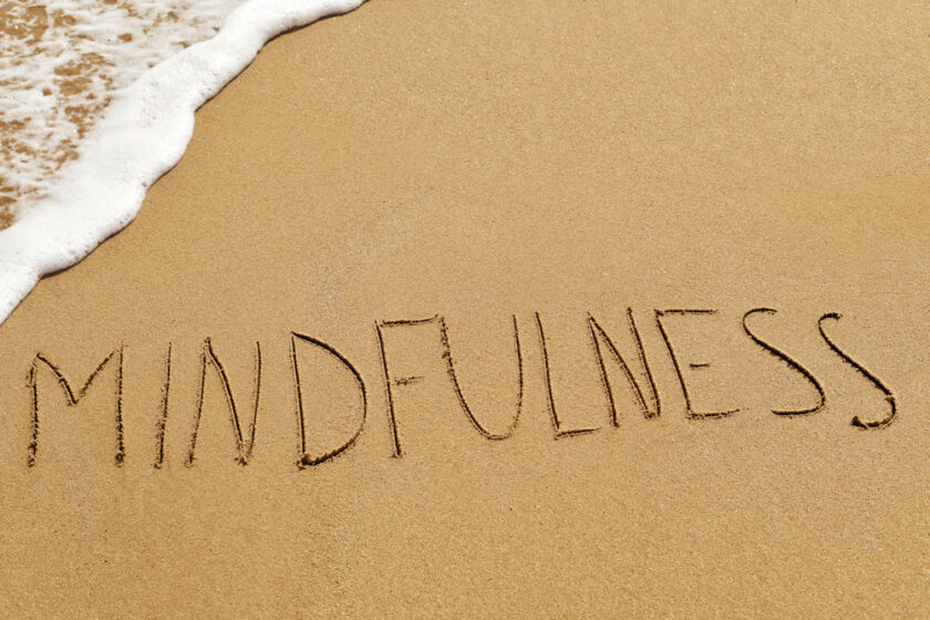 Mindfulness written in the sand