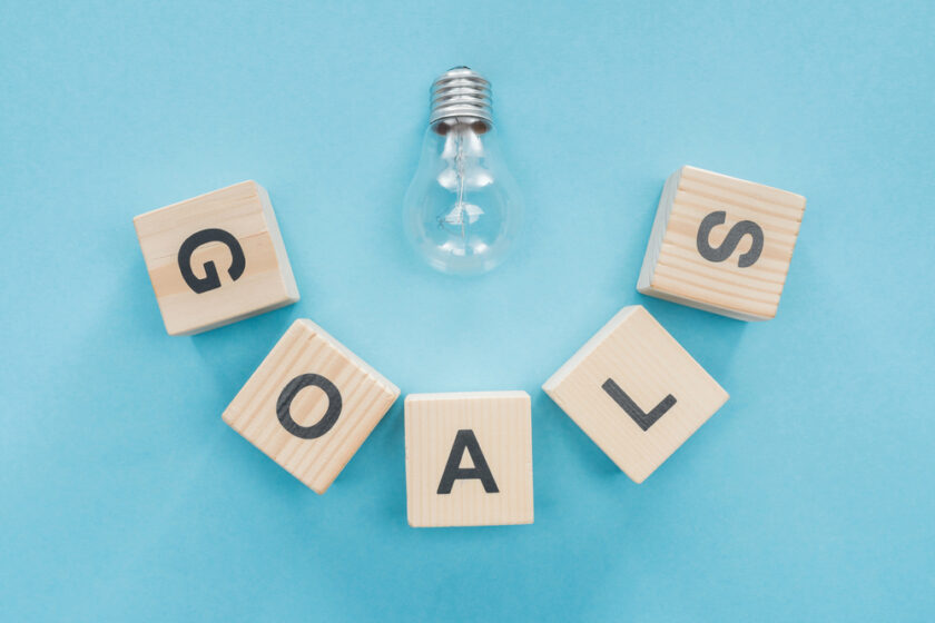 goals written out with a light bulb