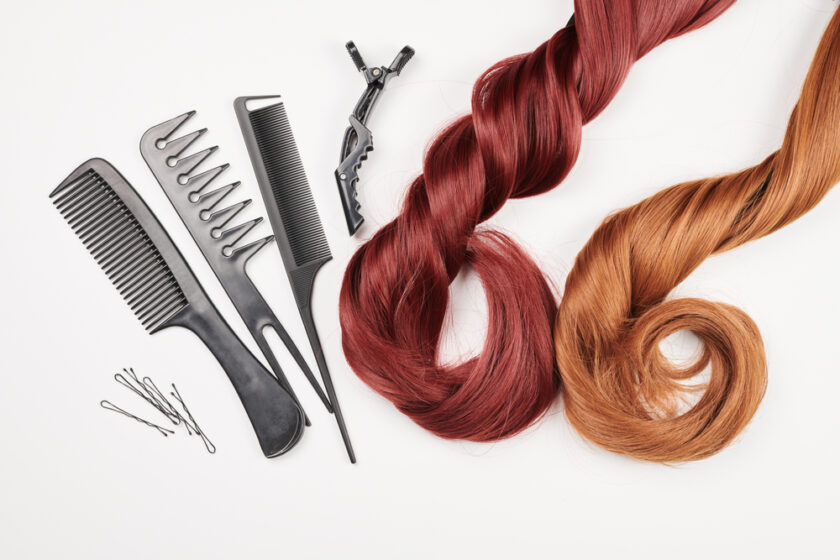 Hairdresser tools close-up isolated on white background. Hair curls and set of combs, clips, hairpins, hair beauty salon concept