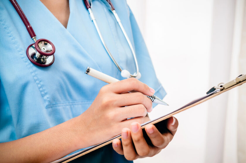 nurse with a clip board
