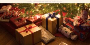 A festive Christmas scene featuring a variety of wrapped gifts in colorful paper adorned with ribbon bows. The packages are placed under a warmly lit tree, and the image is titled Etsy Christmas Gift Guide 2024.
