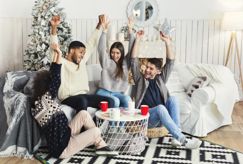 Group of friends playing christmas party games