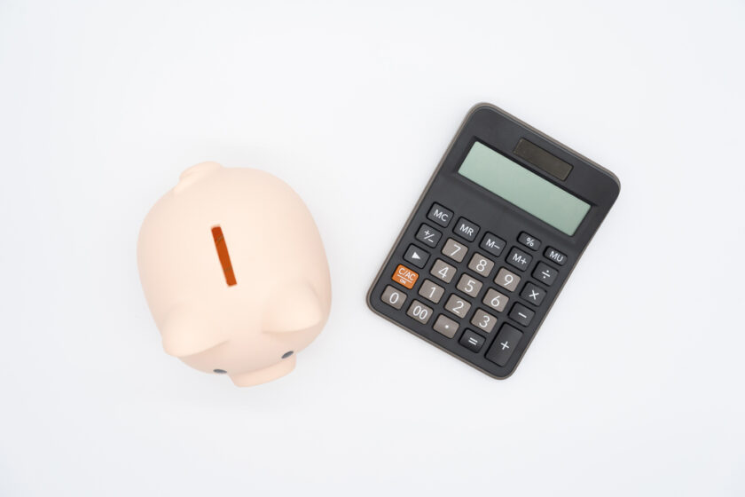 pink piggy bank and a calculator