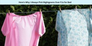 Two nightgowns hang on a clothesline in a leafy garden. One is pink and the other is blue with floral patterns. Text above reads, Heres Why I Always Pick Nightgowns Over PJs for Bed.