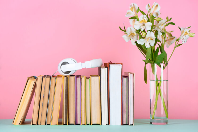 Books headphones and flowers