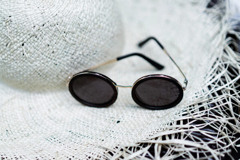 white strawhat and sunglasses