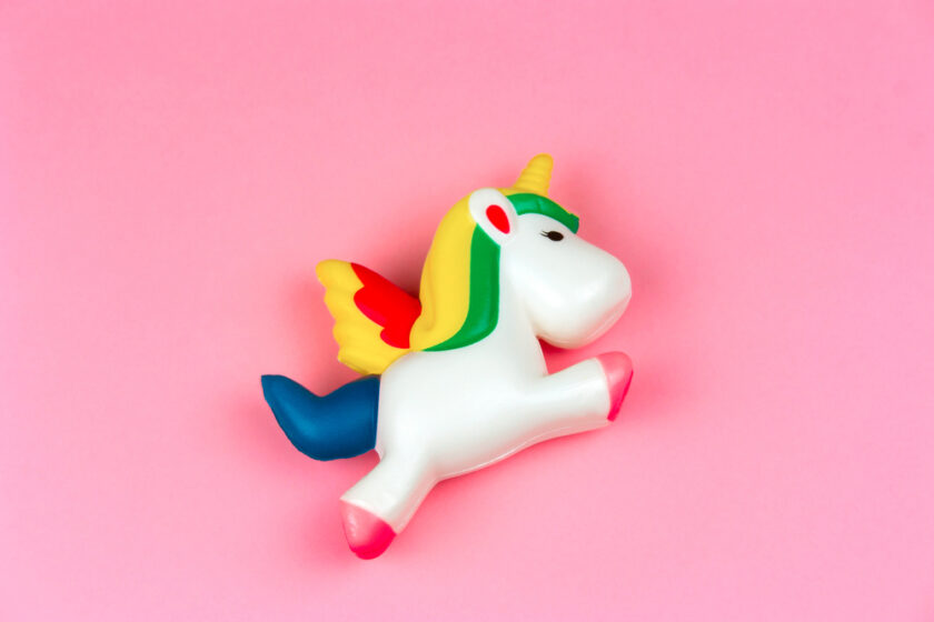 squishy unicorn toy on a pastel pink background