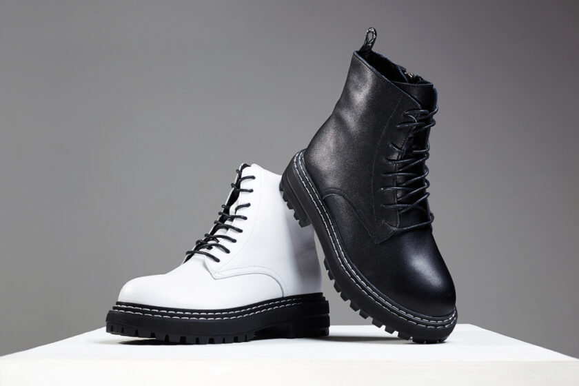 black and white boots. fashion shoes still life. stylish photo in the studio