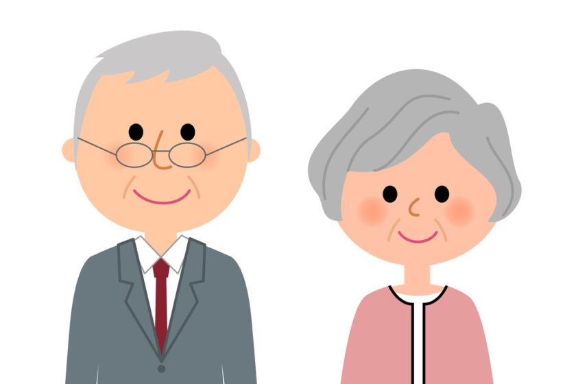 Cartoon illustration of an elderly man in a suit and glasses standing next to an elderly woman with short gray hair wearing a pink cardigan, both smiling.