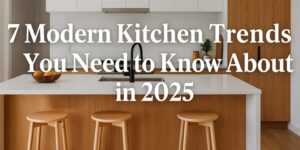 A modern kitchen with a white countertop island, wooden cabinets, three wooden stools, a black faucet, and minimalist decor. Overlaid text reads: 7 Modern Kitchen Trends You Need to Know About in 2025.