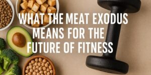 A dumbbell sits on a table next to bowls of tofu, lentils, chickpeas, an avocado, and broccoli. Overlaid text reads: What the meat exodus means for the future of fitness.