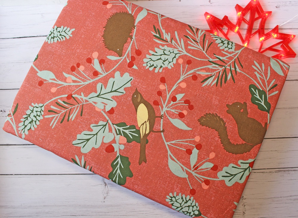 Terrys Fabrics -
Laura Ashley Autumnal Woodland Duvet Cover Bedding Set Crimson Red with illustrations of a bird, a squirrel, a hedgehog, and green leafy branches with red berries,