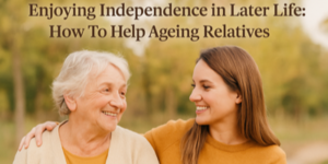 A smiling young woman with her arm around an older woman outdoors, both wearing warm clothing. Text above them reads, Enjoying Independence in Later Life: How To Help Ageing Relatives.