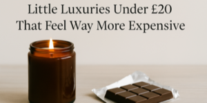 A lit brown candle and an unwrapped chocolate bar sit on a light surface. Text above reads: Little Luxuries Under £20 That Feel Way More Expensive.