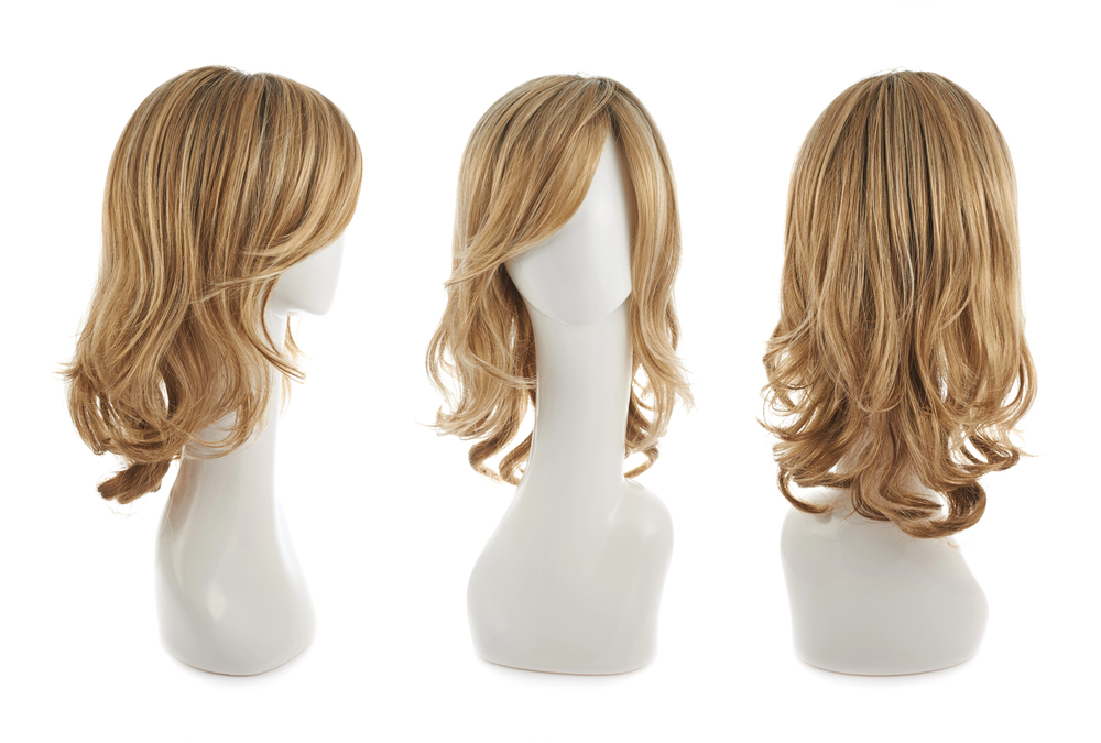 Three views (side, front, back) of a blonde, shoulder-length wavy wig displayed on a white mannequin head against a white background. The wig has layered, slightly curled ends.