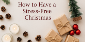 A festive flat lay with candles, pine cones, wrapped presents, red baubles, and a small Christmas tree. Text reads: How to Have a Stress-Free Christmas.