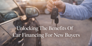 A person holds car keys next to a parked car. The text on the image reads: Unlocking The Benefits Of Car Financing For New Buyers.