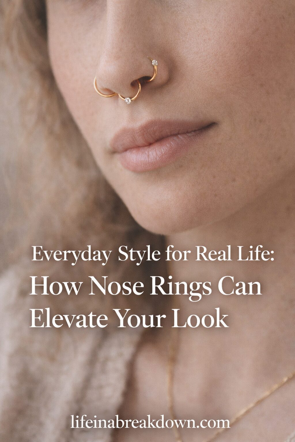Close-up of a woman's face with curly hair, wearing gold nose rings and a necklace. Text overlay reads: Everyday Style for Real Life: How Nose Rings Can Elevate Your Look. lifeinabreakdown.com.
